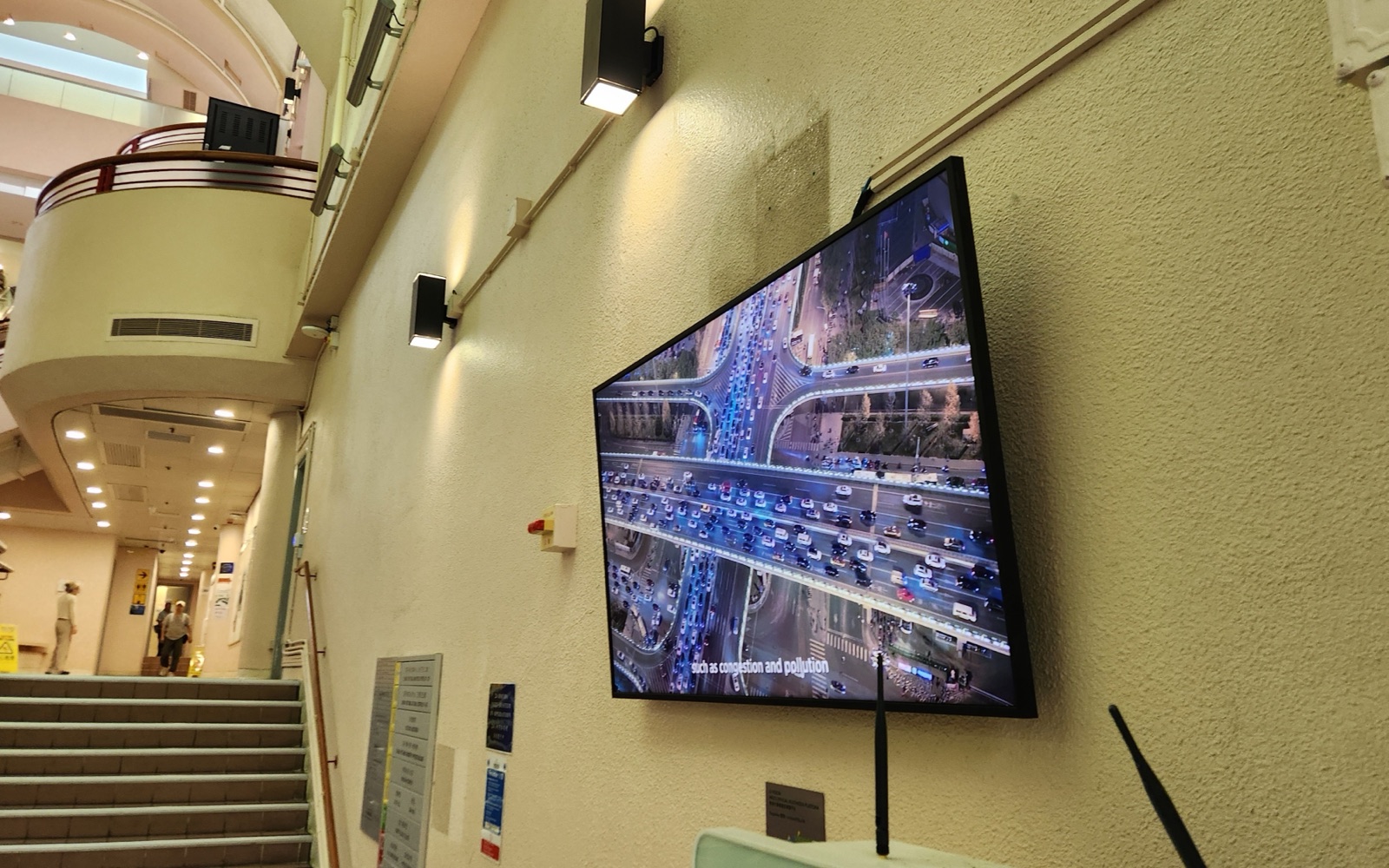 A U-Vision screen mounted on the wall by the ground-floor stairwell of the Chong Yuet Ming Amenities Centre