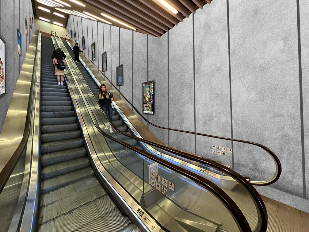 The Exit C escalator on Centennial Campus, its wall lined with U-Vision portrait screens