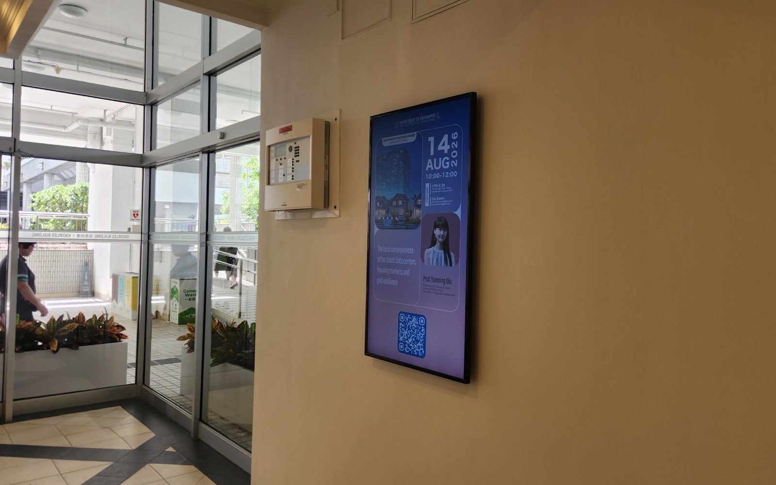 A U-Vision screen in a timber-framed wall recess just inside the Knowles Building entrance